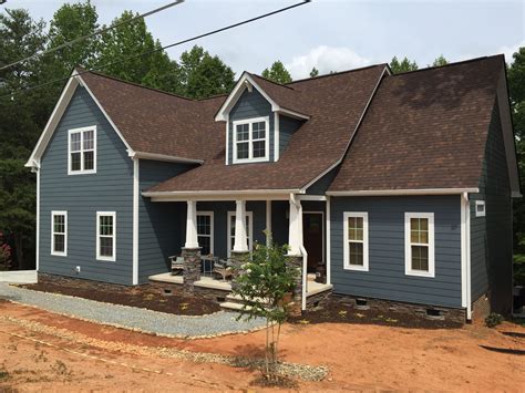 brown roof blue house